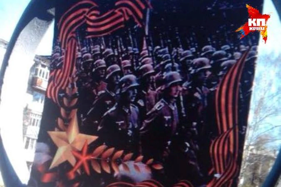 Тот самый скандальный плакат: вместо советских солдат на нем маршируют фашисты. Фото: соцсети