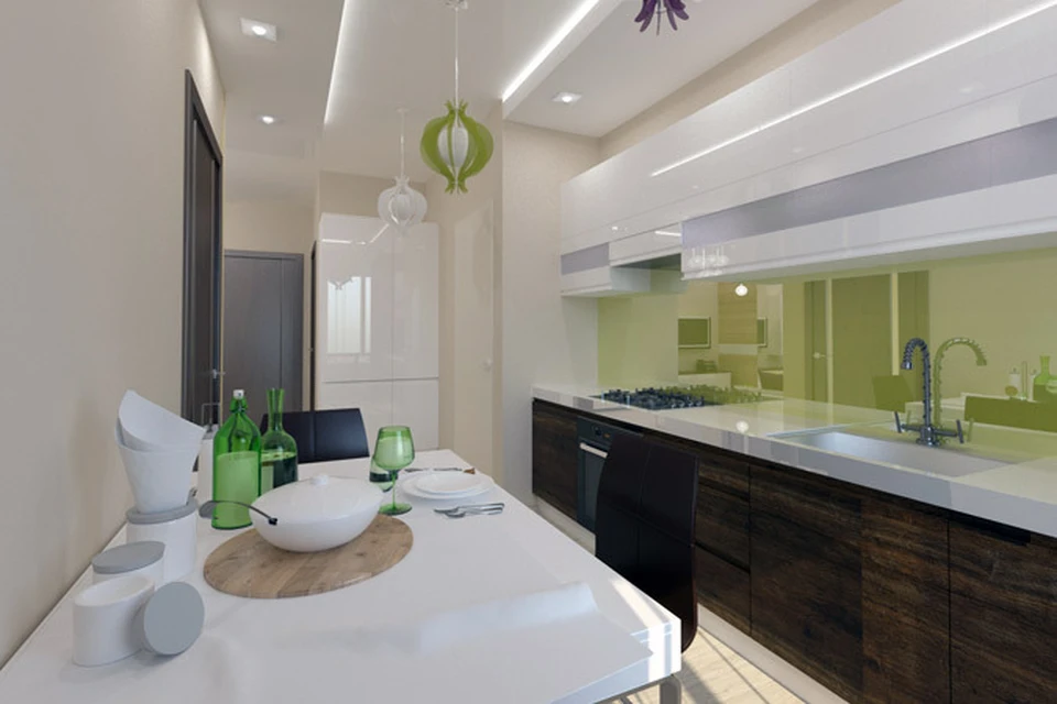 Пастельные тона отделки стен, глянцевые зеленые фасады и светлый пол визуально делает пространство кухни больше.
